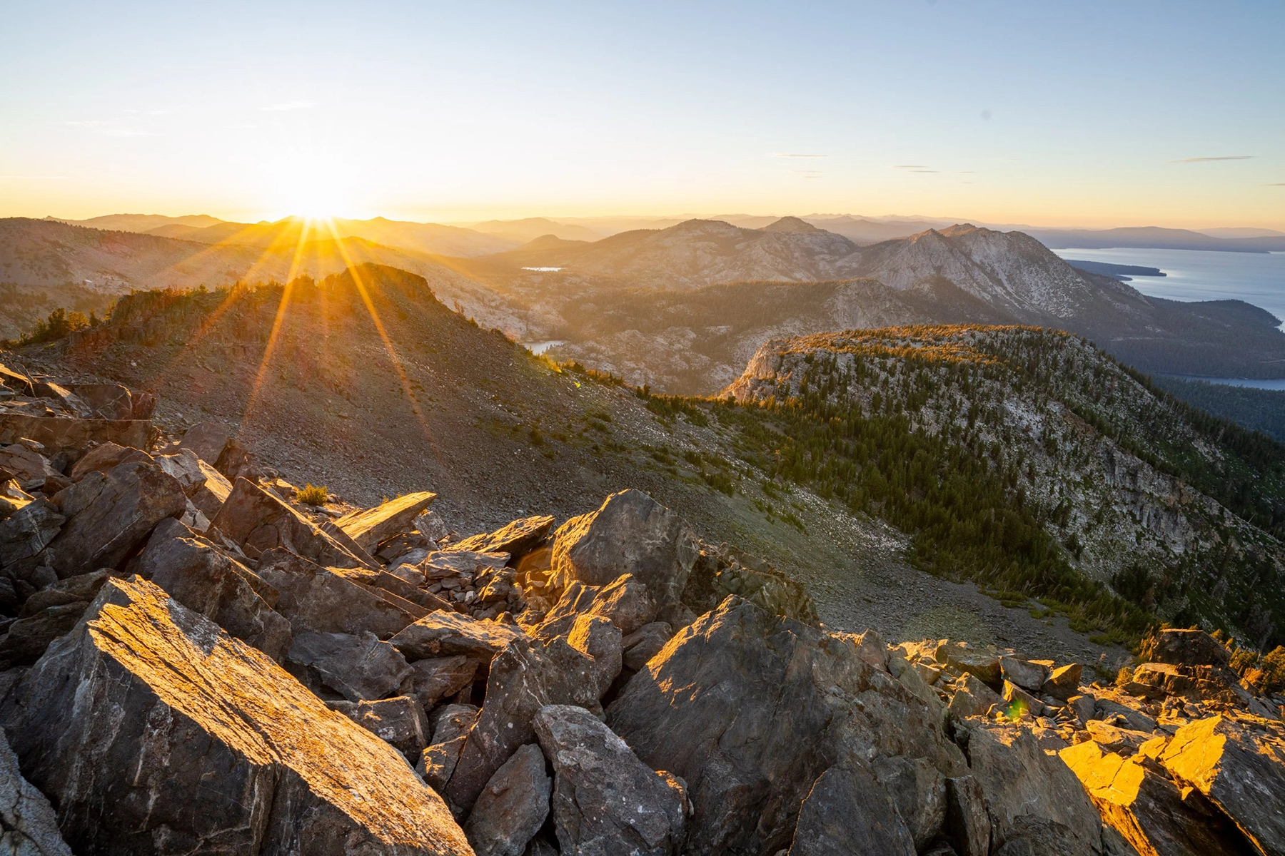 Sunstar at sunset over the mountains