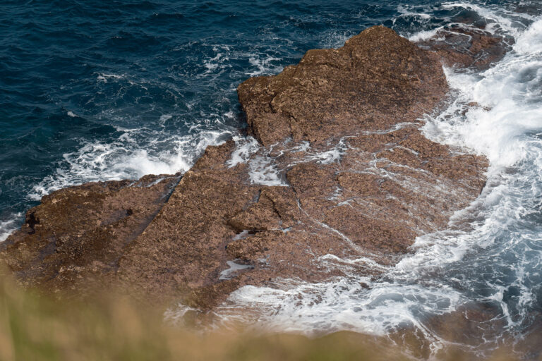 Waves crashing onto rocks