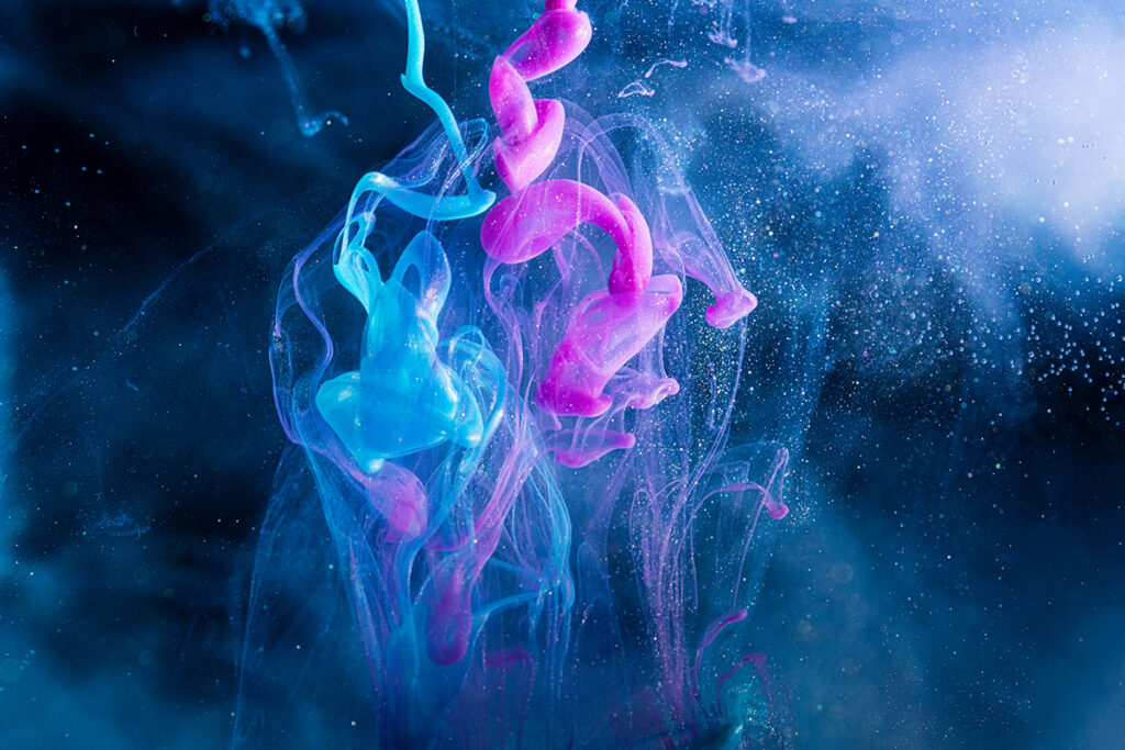 Colored acrylic ink drops in water.