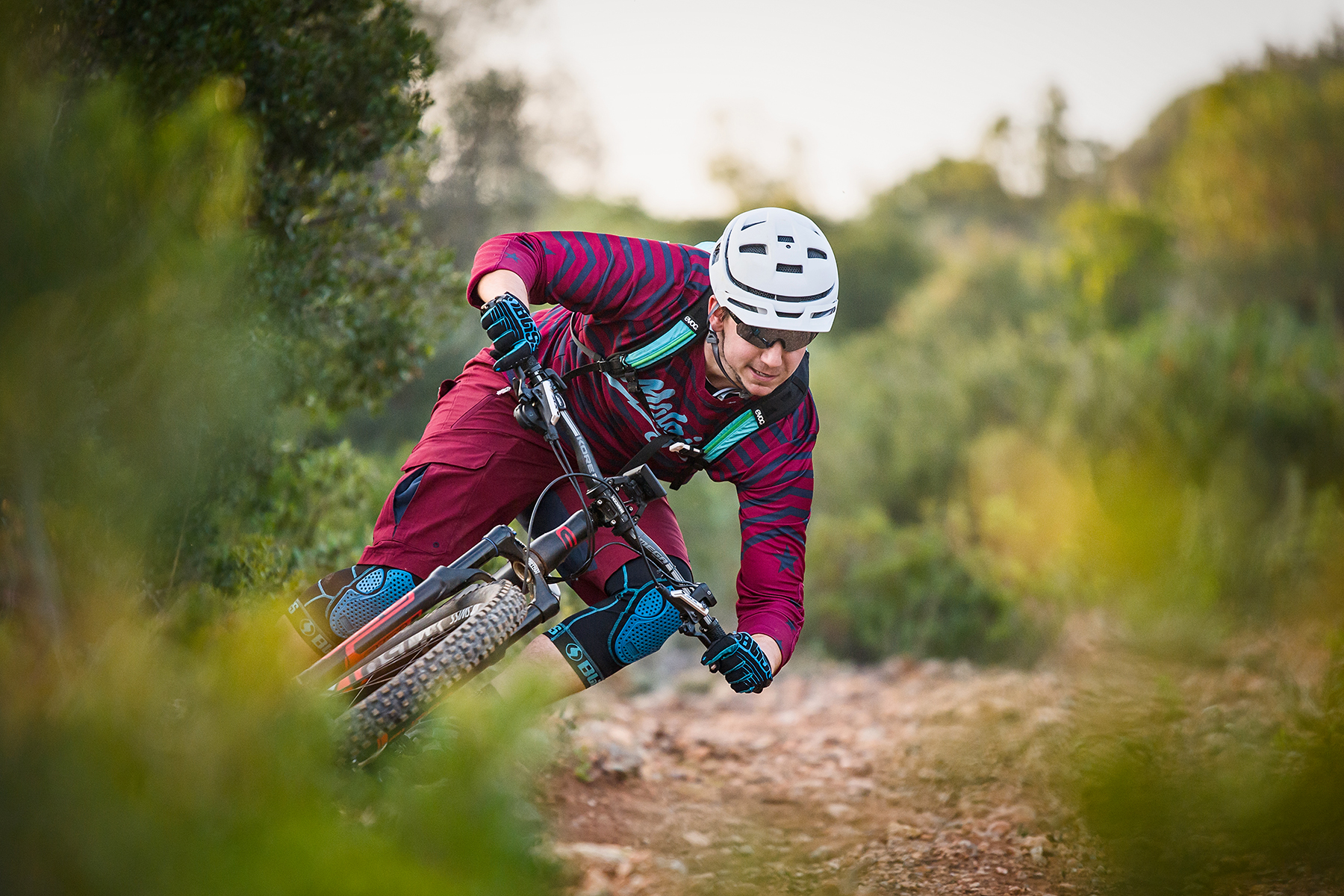 Dynamic mountain biking action captured in vivid detail with the Tamron 70-200 for DSLR cameras, showcasing the rider's skill and determination on rugged terrain.