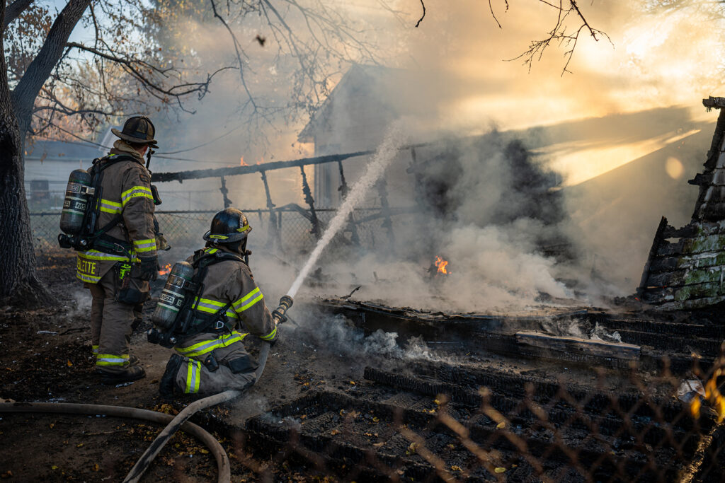 two firefighters in amazing light