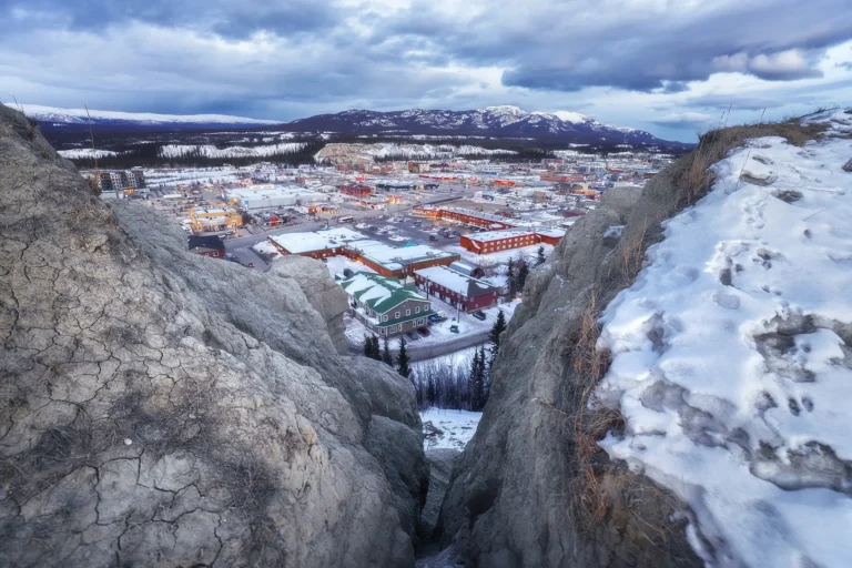 During the Tamron 16-30mm field test, this dramatic wide-angle view from a snowy cliff edge captures the town of Whitehorse nestled in the Yukon landscape, showcasing the lens’s perspective distortion and edge-to-edge clarity.