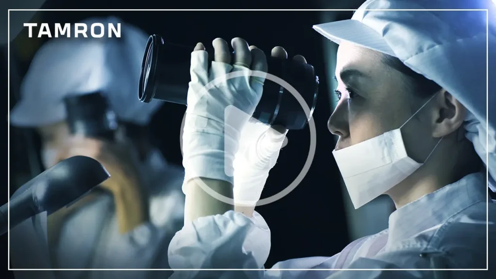 Tamron technician inspecting camera lens in production, part of the Tamron brand story