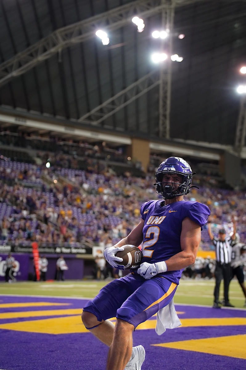 A football player that just scored a touchdown.