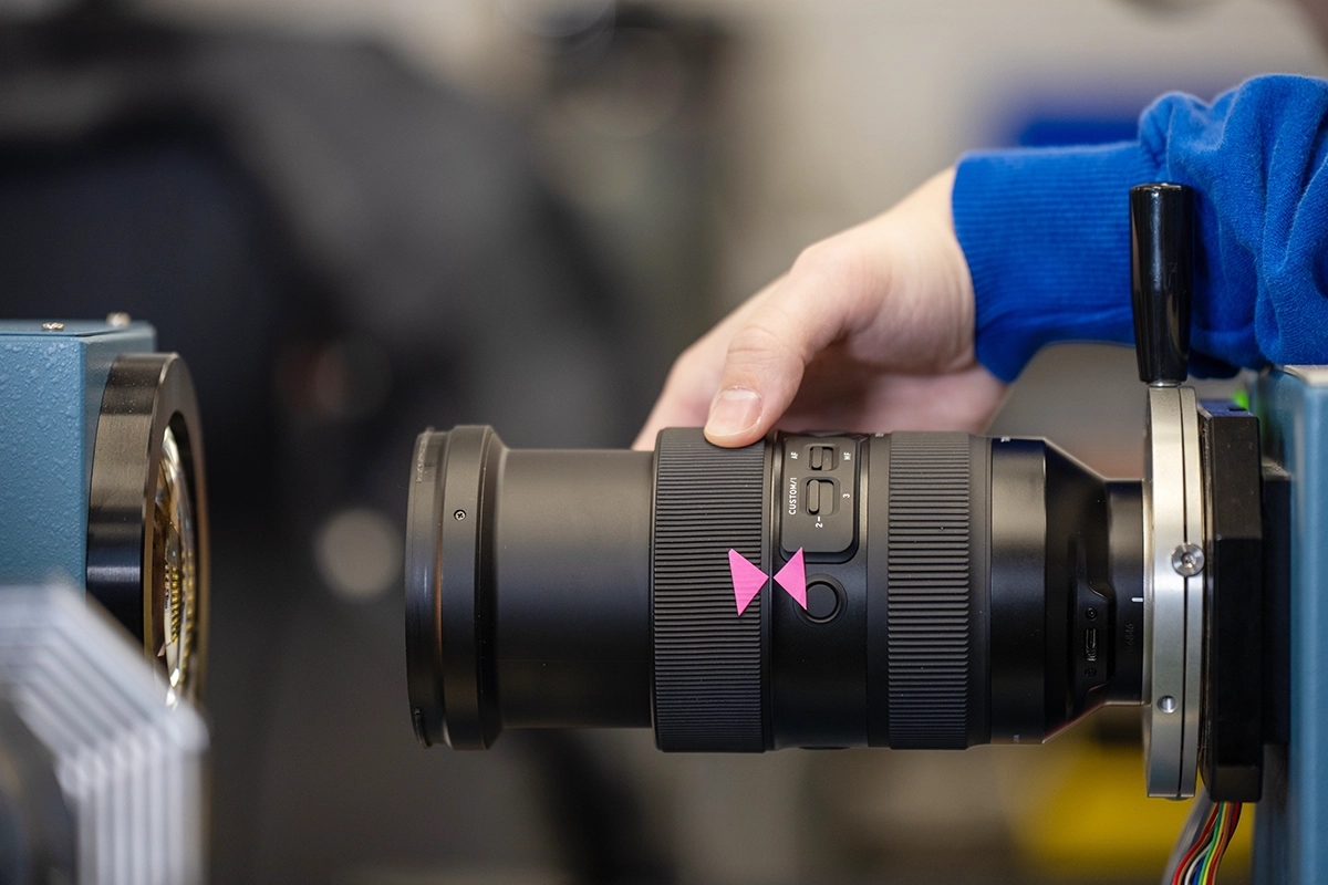 Tamron lens undergoing calibration and inspection as part of the free annual clean and check service.