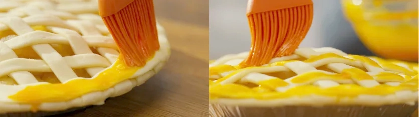 Close-up of a pastry brush applying egg wash to a lattice pie crust to create texture and focus detail in a fast-paced montage.