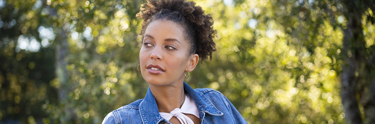 Portrait of a woman outdoors photographed with the Tamron 35-100mm F/2.8 Di III VXD lens during a winery vacation.