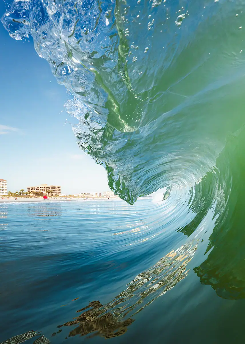 A wave curling towards the water.