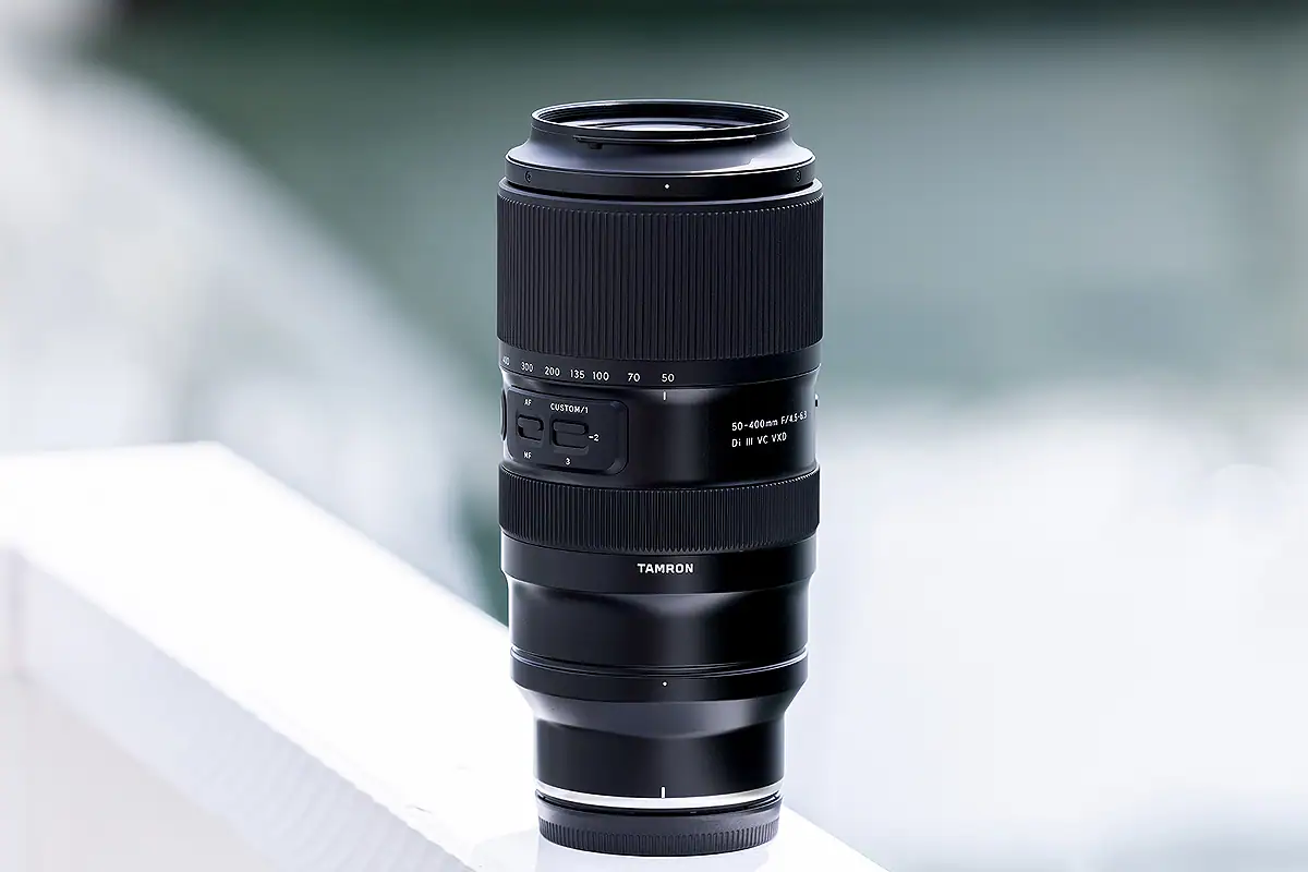 Tamron 50-400mm zoom lens showing a variable focal length design for flexible shooting across changing distances.