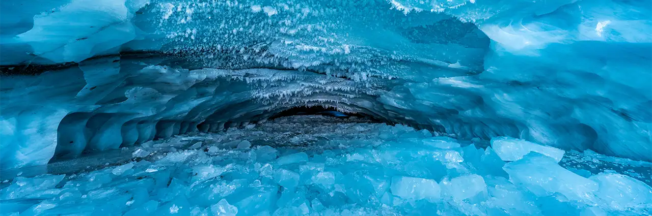Blue glacial ice cave in Alaska photographed with the Tamron 12-20mm F2.8 ultra wide-angle lens.
