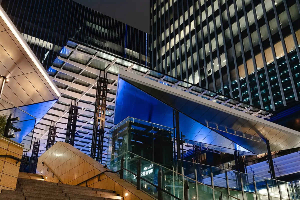 Modern city architecture illuminated at night, photographed with the Tamron 17-70mm lens.