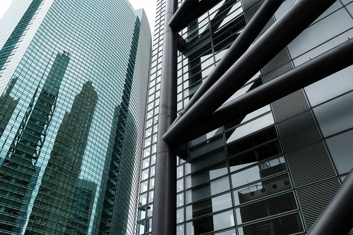 Modern glass buildings and geometric architectural details photographed with the Tamron 18-300mm lens for Canon RF mount.