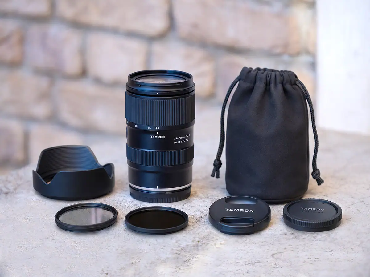 Tamron 28-75mm F2.8 G2 lens with circular polarizer, ND filter, lens hood, front and rear lens caps, and lens pouch.