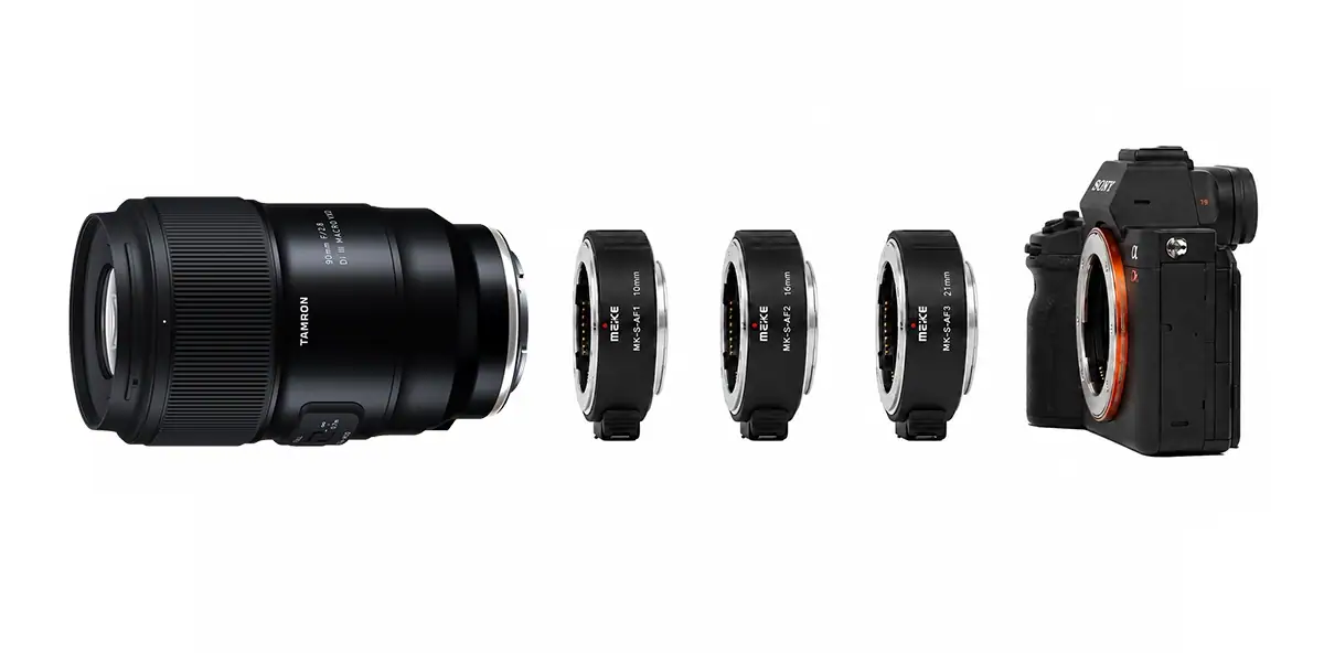 Tamron 90mm F2.8 macro lens with Meike extension tubes for Sony positioned between the lens and a Sony mirrorless camera.