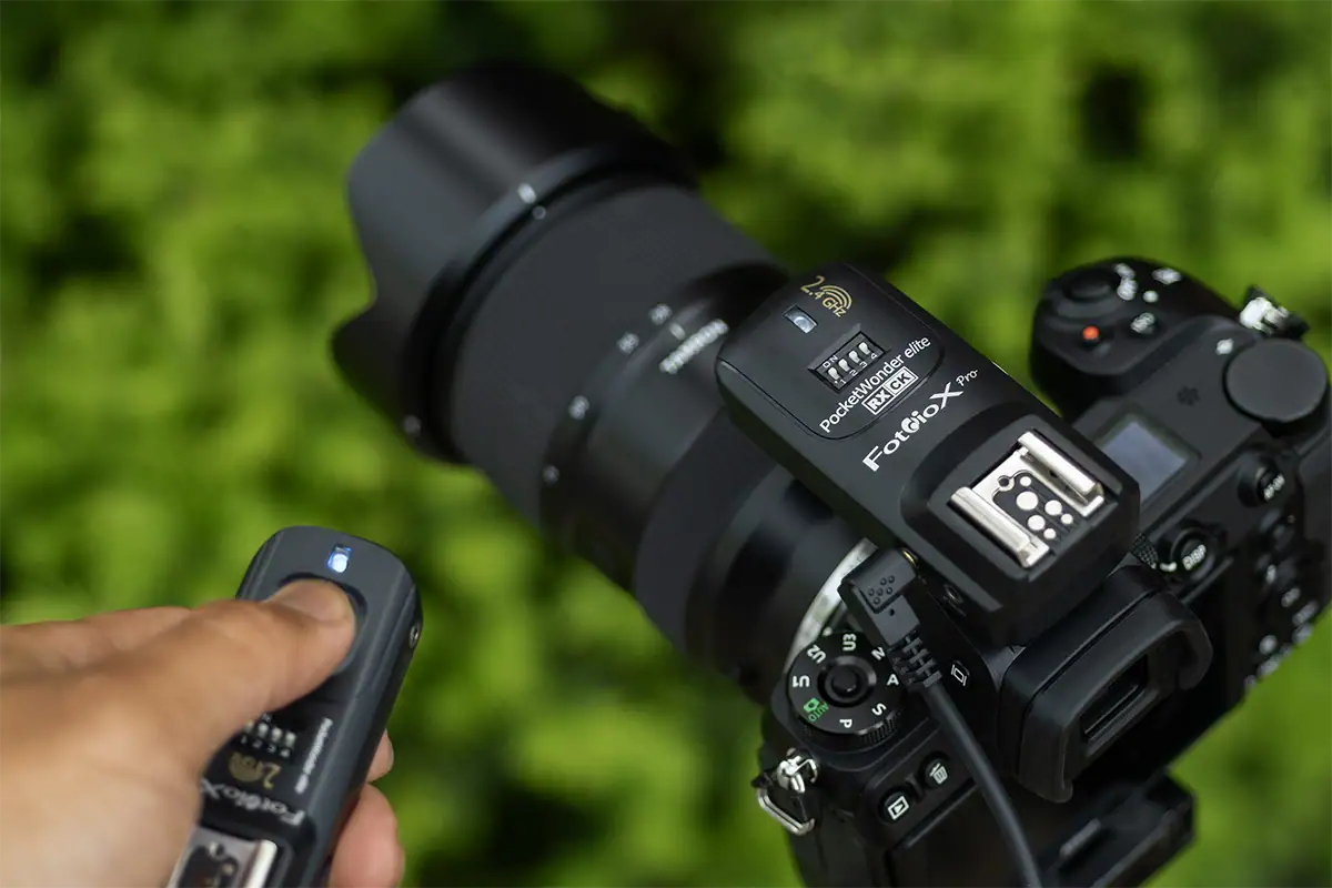 Wireless remote shutter release and receiver used with a camera and Tamron lens to trigger the shutter without touching the camera.